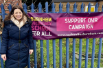 Joy in front of Burnham School campaign banner